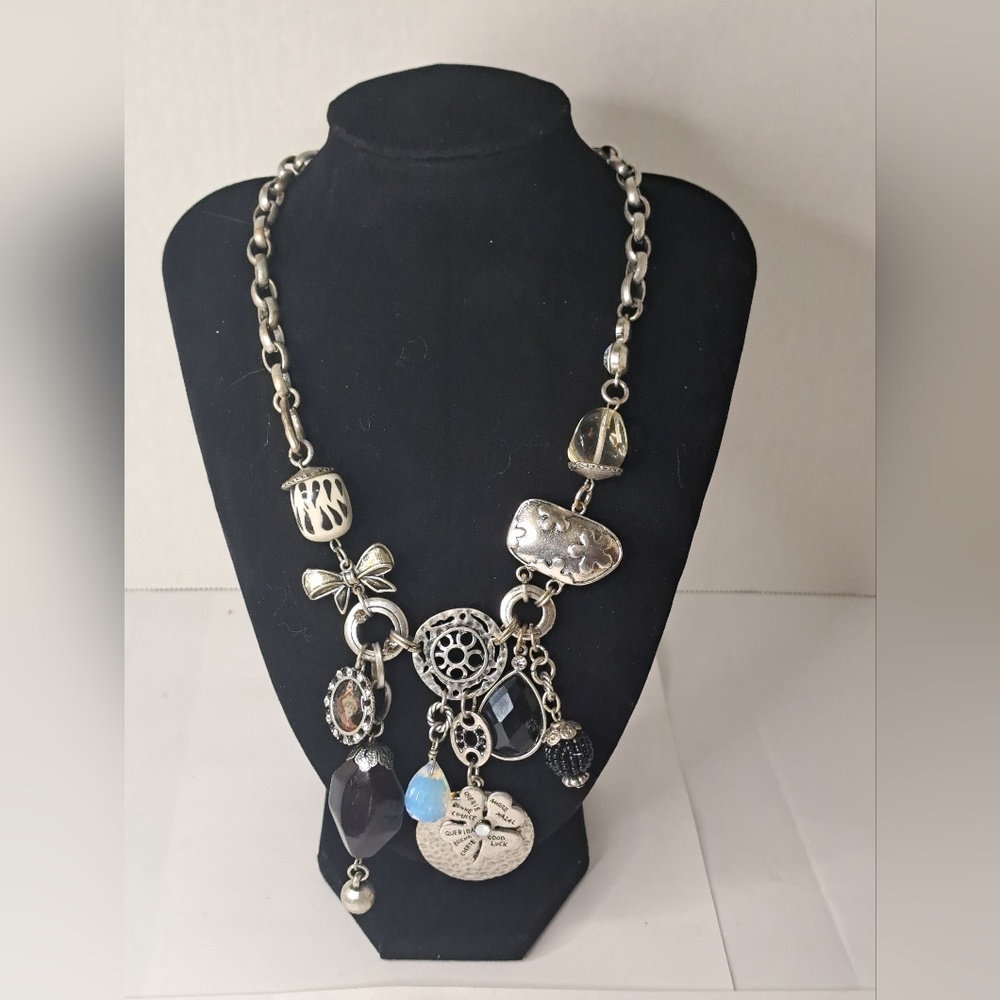 Multi charm necklace, silver tone.